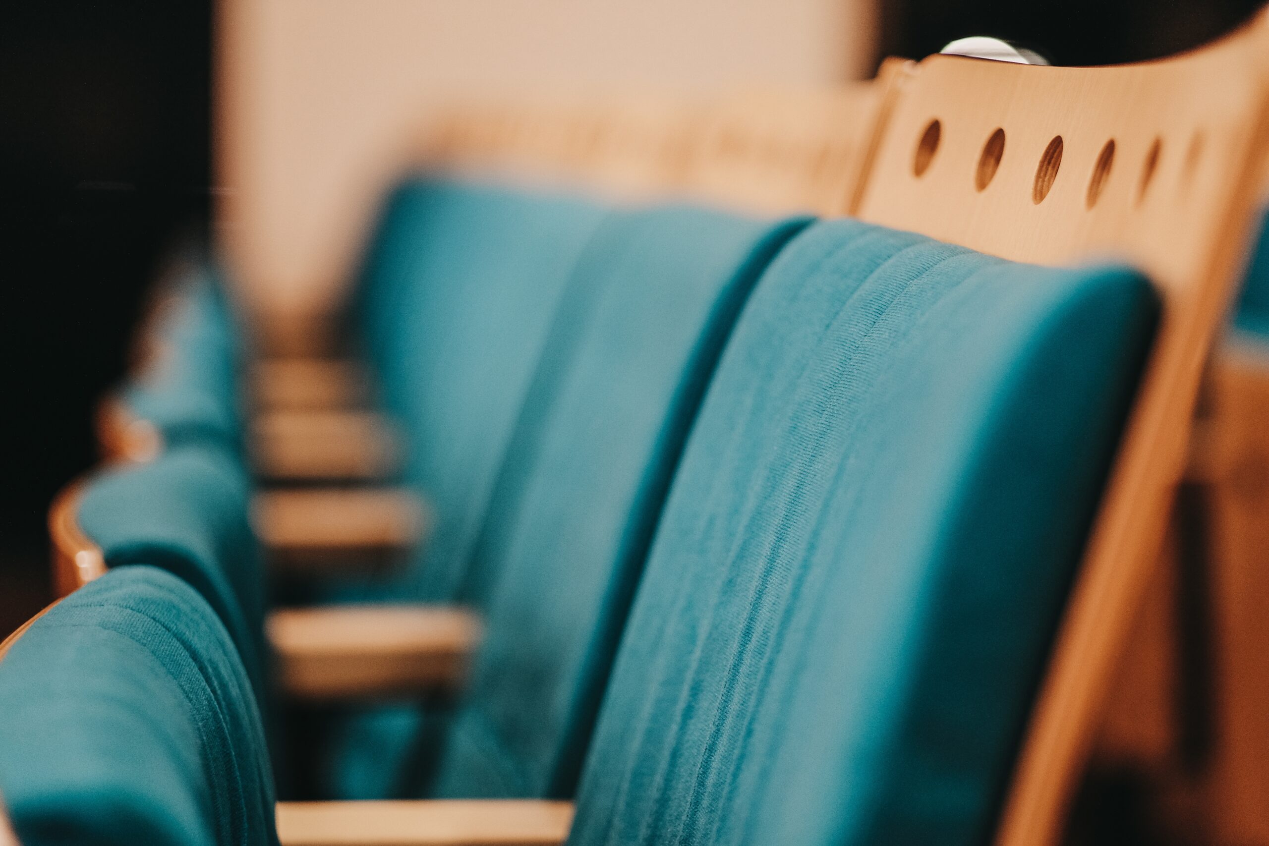 Close up shot of blue and beige chairs next to each other