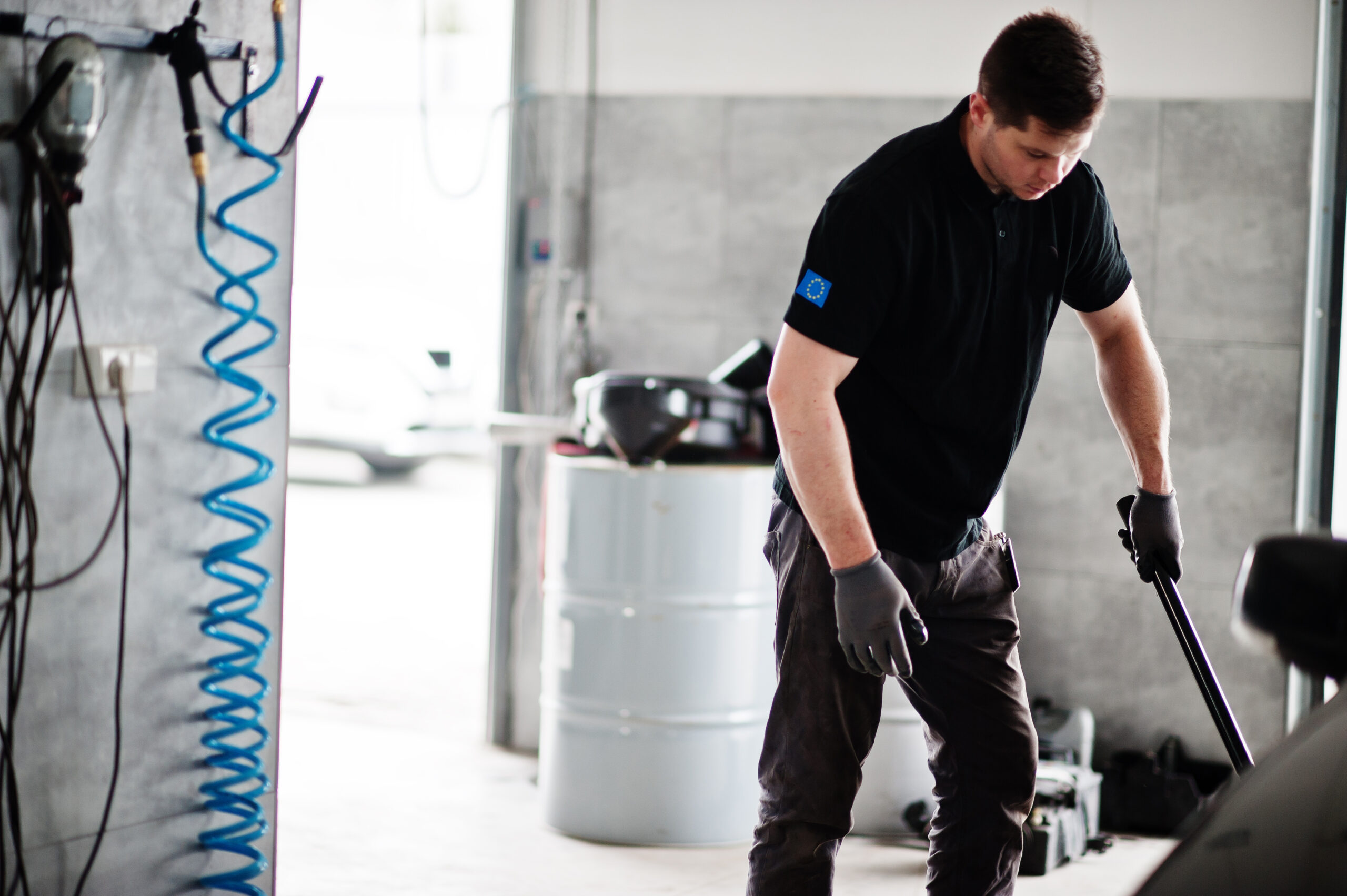 Car repair and maintenance theme. Mechanic in uniform working in