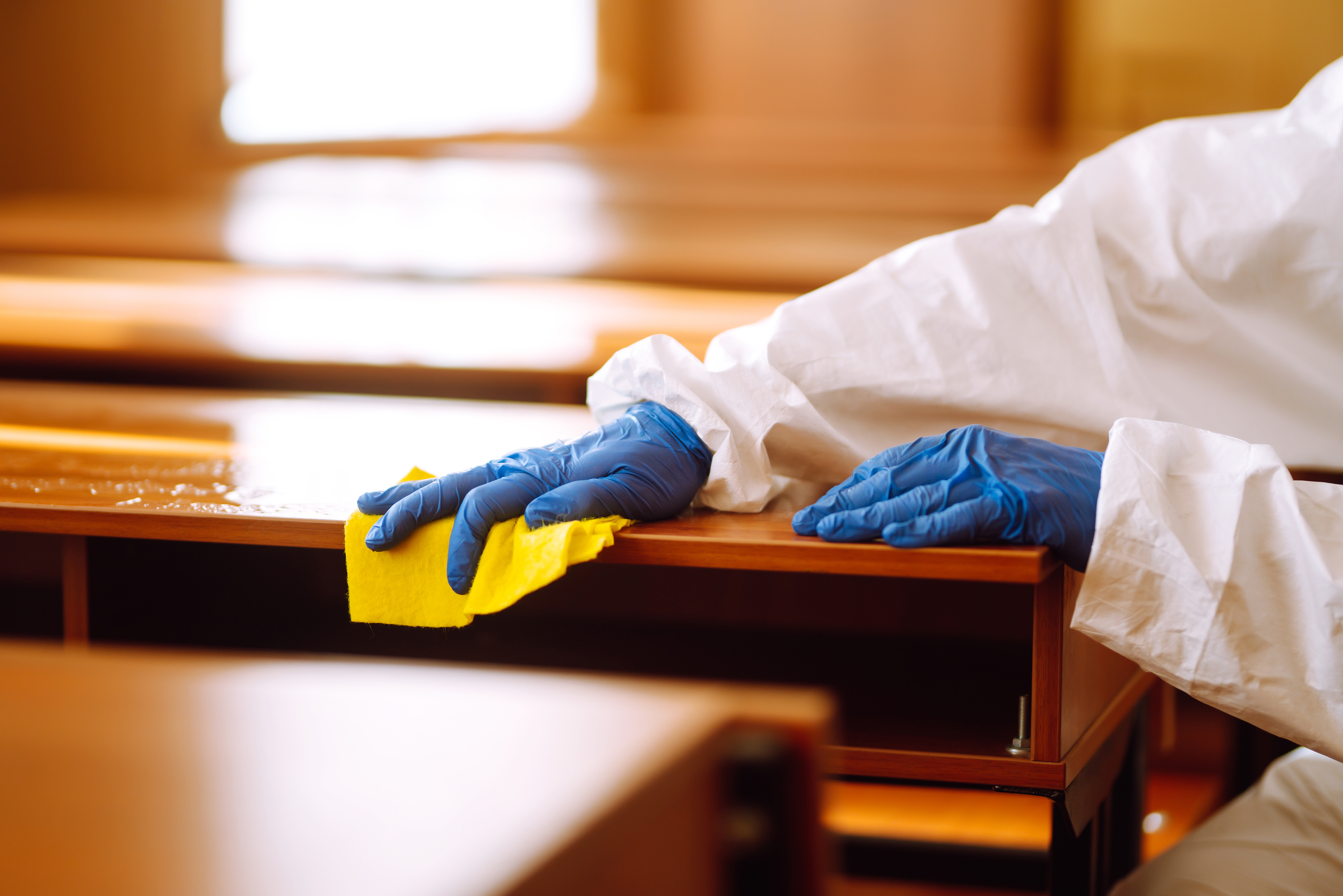 Cleaning and disinfection school desk during coronavirus pandemic. COVID-19.